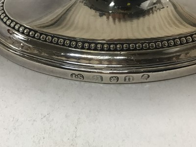 Lot 152 - A fine pair of George III Neo-Classical silver sauce tureens by John Schofield, London 1788.