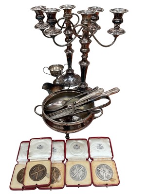 Lot 333 - Pair of silver plated three branch candelabrum, other plated ware, two silver and three bronze ski medallions in fitted red leather cases