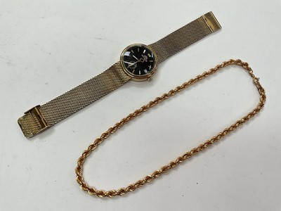 Lot 1042 - 9ct gold ropetwist chain and Astron gold plated wristwatch (2)