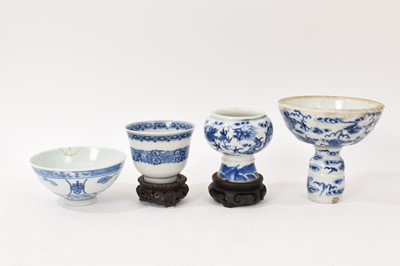 Lot 26 - Four piece of 18th and 19th century Chinese blue and white porcelain, including a candlestick / oil lamp base, vase, bowl and tea bowl