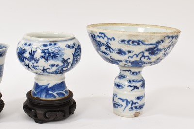 Lot 26 - Four piece of 18th and 19th century Chinese blue and white porcelain, including a candlestick / oil lamp base, vase, bowl and tea bowl