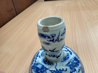 Lot 26 - Four piece of 18th and 19th century Chinese blue and white porcelain, including a candlestick / oil lamp base, vase, bowl and tea bowl