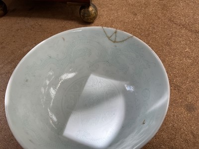 Lot 26 - Four piece of 18th and 19th century Chinese blue and white porcelain, including a candlestick / oil lamp base, vase, bowl and tea bowl