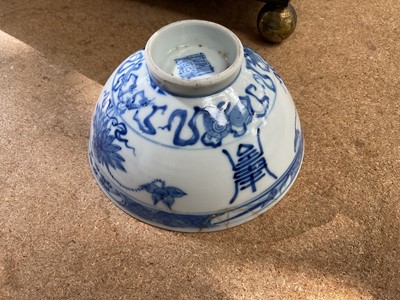 Lot 26 - Four piece of 18th and 19th century Chinese blue and white porcelain, including a candlestick / oil lamp base, vase, bowl and tea bowl