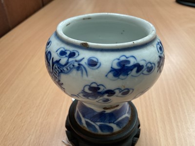 Lot 26 - Four piece of 18th and 19th century Chinese blue and white porcelain, including a candlestick / oil lamp base, vase, bowl and tea bowl