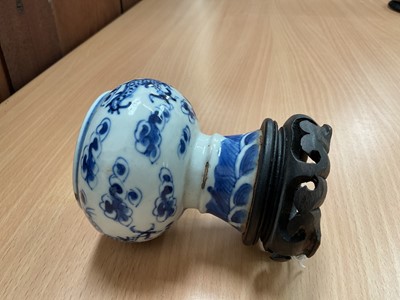 Lot 26 - Four piece of 18th and 19th century Chinese blue and white porcelain, including a candlestick / oil lamp base, vase, bowl and tea bowl