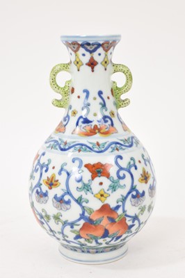 Lot 41 - Chinese porcelain twin-handled vase, 20th century decorated in the Doucai style, Qianlong seal mark to base