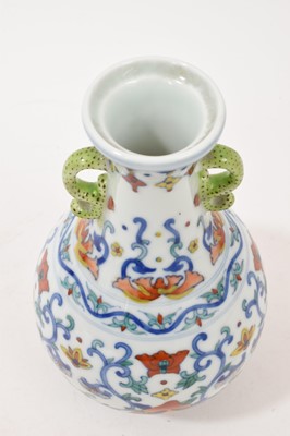 Lot 41 - Chinese porcelain twin-handled vase, 20th century decorated in the Doucai style, Qianlong seal mark to base