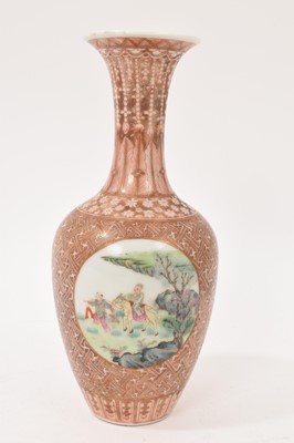 Lot 42 - Chinese porcelain baluster vase, 20th century, painted in famille rose enamels with circular panels containing figures and landscapes, on a patterned ground in gilt and red enamel, Qianlong seal...
