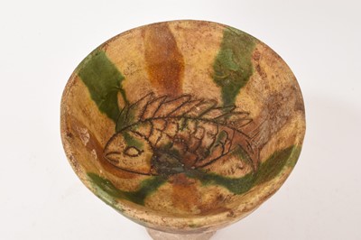 Lot 40 - Chinese Sancai glazed stem cup, with incised fish decoration