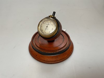 Lot 2414 - Stanley Compensated pocket barometer on carved wooden stand
