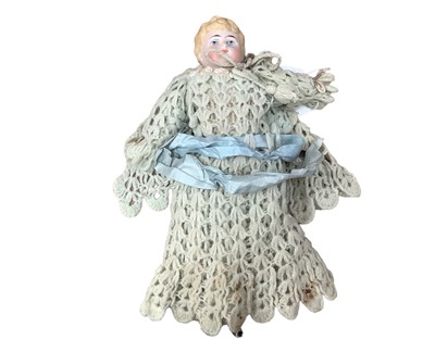 Lot 744 - Victorian China head and shoulder doll marked 1222 3/0, with moulded blonde curly hair, painted features, china lower arms and leg (one lower leg missing), fabric waisted body.