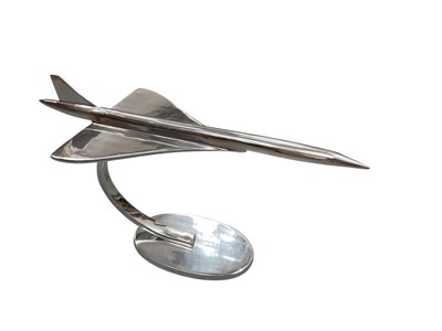 Lot 400 - Large contemporary polished metal aircraft model in the form of Concorde, 71.5cm in length.