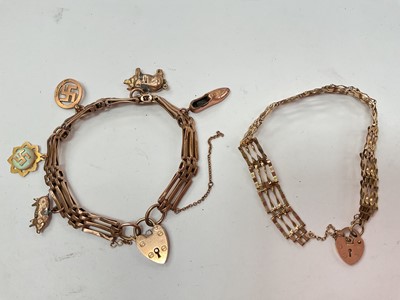Lot 1066 - Two 9ct gold gate bracelets both with padlock clasps and one with various charms