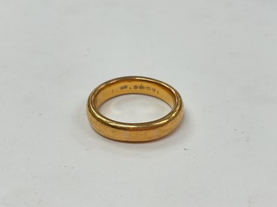 Lot 1067 - 22ct gold wedding ring (Birmingham 1927), size O½