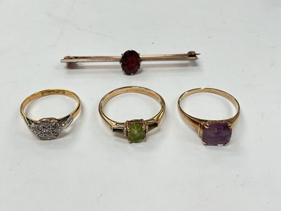 Lot 1068 - 18ct gold diamond flower head cluster ring in platinum setting, two 9ct gold gem set dress rings and a yellow metal gem set bar brooch (4)