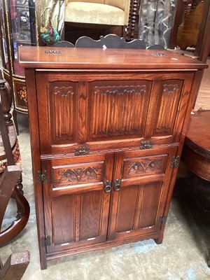 Lot 1224 - Old Charm oak cabinet with fall flap and leather lined slope, 76cm wide, 37cm deep, 109cm high
