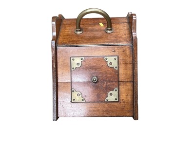Lot 1228 - Edwardian oak coal scuttle with brass handle and mounts together with a brass coal scuttle