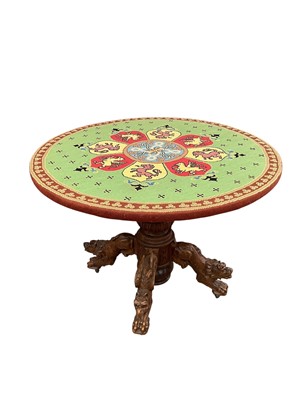 Lot Unusual 19th century carved oak centre table with embroidery to the circular top raised on carved animal supports