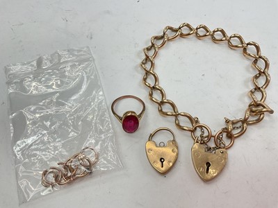 Lot 1087 - 9ct gold curb link bracelet with two padlock clasps, yellow metal gem set ring and some spare links