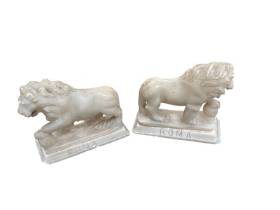 Lot 412 - Pair of Grand Tour carved alabaster sculptures in the form of the Medici Lions, each approximately 10cm in height, (2).
