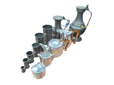 Lot 426 - Piquot ware teaset, together with two pewter flagons and a graduated set of pewter measures.