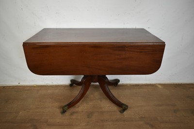 Lot 1362 - George III mahogany sofa table on turned support and four splayed reeded legs with brass capped castors