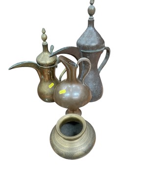Lot 438 - Two Islamic Dallah coffee pots, together with other eastern metalwares (4).