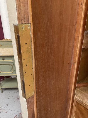 Lot 1353 - An impressive antique rococo revival wardrobe, the central mirrored doors enclosing five flanked by two cupboards, decorated with putti and foliate trailing decoration highlighted in gilt, on sc...