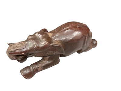 Lot 440 - Large carved wooden elephant sculpture, 47cm in overall length.