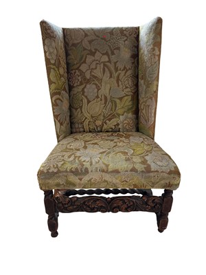 Lot 1355 - 19th century Jacobean revival wing chair with needlework upholstery, carved scroll frieze and barley twist supports