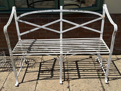 Lot 1369 - Antique white painted cast iron garden bench with reeded scroll arms, 126cm wide x 51cm deep x 94cm high