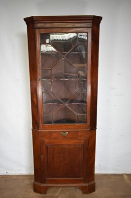 Lot 1288 - George III mahogany two height standing corner cupboard