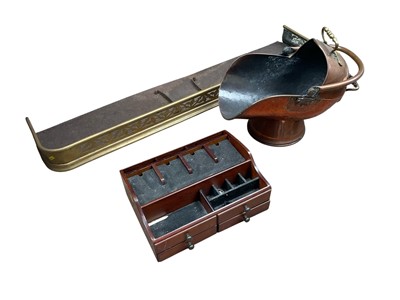 Lot 272 - Victorian brass fender, copper coal scuttle and a mahogany book trough. (3)