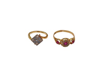 Lot 1106 - 18ct gold sapphire and diamond set square plaque crossover ring and antique 18ct gold ruby and diamond ring (2)