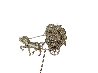 Lot 70 - 1950s silver and marcasite novelty brooch in the form of a horse pulling a floral carriage with a concealed Bimesa watch, 50mm