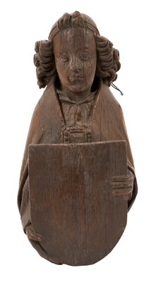 Lot 655 - Ecclesiastical carved oak roof boss, in the form of a saint, holding a shield, possibly mediaeval, 28cm high
