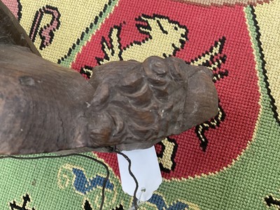 Lot 655 - Ecclesiastical carved oak roof boss, in the form of a saint, holding a shield, possibly mediaeval, 28cm high