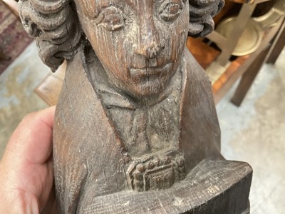 Lot 655 - Ecclesiastical carved oak roof boss, in the form of a saint, holding a shield, possibly mediaeval, 28cm high