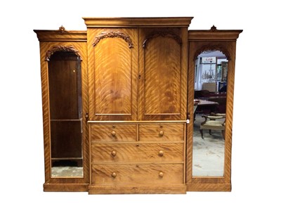 Lot 1325 - Victorian satin birch breakfront compactum wardrobe, the central section with slides enclosed by panel doors and two short over two long drawers below, flanked by mirrored wardrobes, on plinth c...