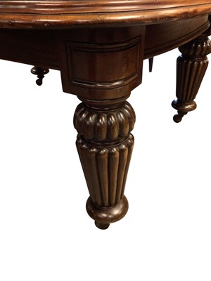 Lot 1337 - Very large mahogany extending dining table, the rounded rectangular top on massive fluted legs and castors, to include four additional leaves, 136cm wide with 158cm long, extending to approximat...