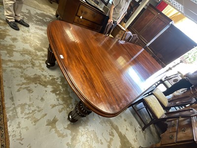 Lot 1337 - Very large mahogany extending dining table, the rounded rectangular top on massive fluted legs and castors, to include four additional leaves, 136cm wide with 158cm long, extending to approximat...
