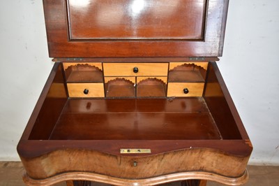 Lot 1338 - Victorian walnut desk, with pierced gallery over hinged stationery compartment and leather inset slope enclosing fitted interior of drawers and pigeon holes, raised on pierced ends and splayed s...