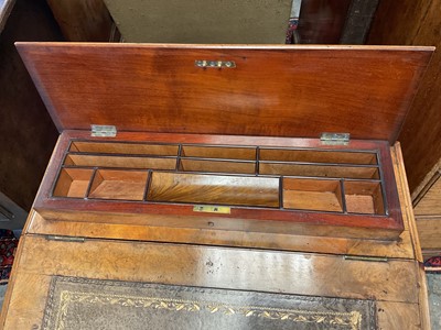 Lot 1338 - Victorian walnut desk, with pierced gallery over hinged stationery compartment and leather inset slope enclosing fitted interior of drawers and pigeon holes, raised on pierced ends and splayed s...