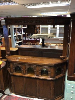 Lot 1319 - Old Charm carved oak two height bar with glazed panels, 159cm wide, 37cm deep, 229cm high