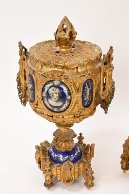 Lot 639 - 19th century French ormolu three piece clock set with inset enamelled panels depicting military figures