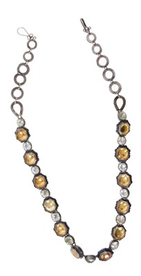 Lot 477 - Antique rock crystal and paste rivière necklace with foil-backed coloured paste stones in and rock crystal stones piecrust silver setting