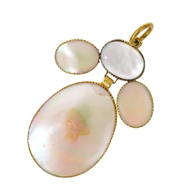 Lot 478 - Antique 'coquette de pearle' and mother of pearl girandole pendant in yellow metal setting on a gilt metal ring ring