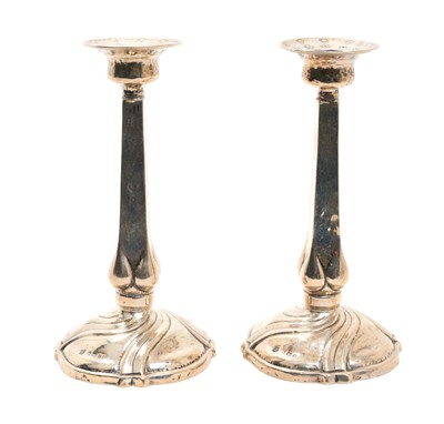 Lot 183 - Pair of Arts & Crafts silver candlesticks