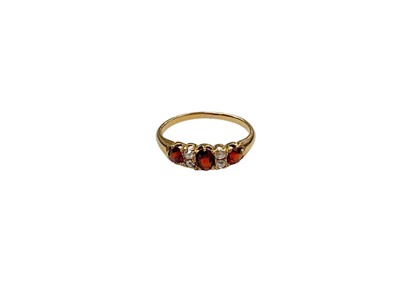 Lot 1146 - Edwardian gold garnet and diamond ring